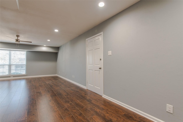 spare room featuring recessed lighting, a ceiling fan, dark wood-style flooring, and baseboards