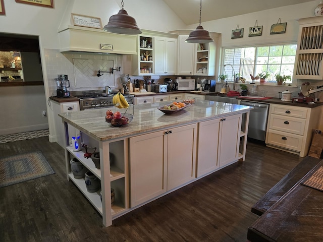 kitchen with stainless steel dishwasher, open shelves, white microwave, dark wood-type flooring, and a sink
