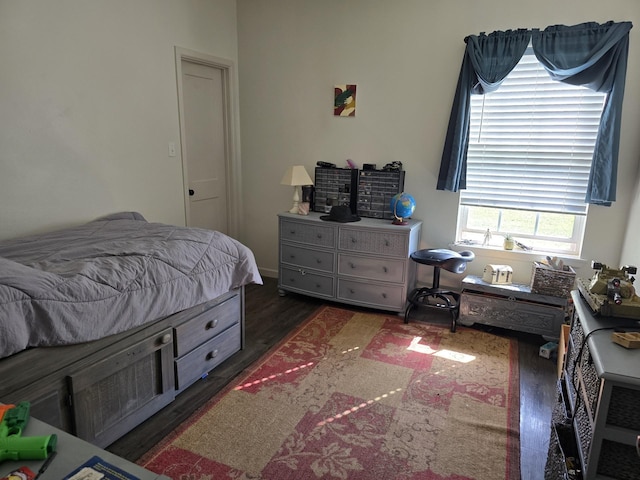 bedroom featuring wood finished floors