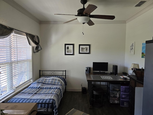 bedroom featuring visible vents, ornamental molding, wood finished floors, baseboards, and ceiling fan