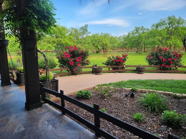 exterior space with fence and a yard