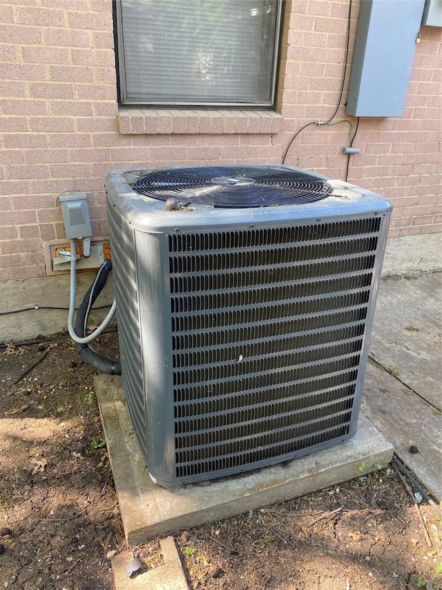details with brick siding and central AC unit