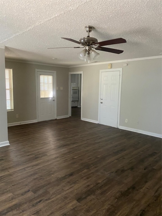 unfurnished room with crown molding, baseboards, a ceiling fan, a textured ceiling, and dark wood-type flooring