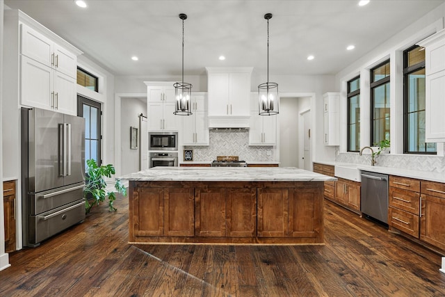 502 Vz County Road 1915, Fruitvale, TX 75127 - kitchen with a sink, backsplash, stainless steel appliances, and dark wood-type flooring