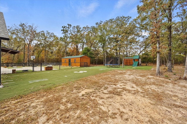 502 Vz County Road 1915, Fruitvale, TX 75127 - view of yard with a trampoline, fence, a storage unit, and an outbuilding