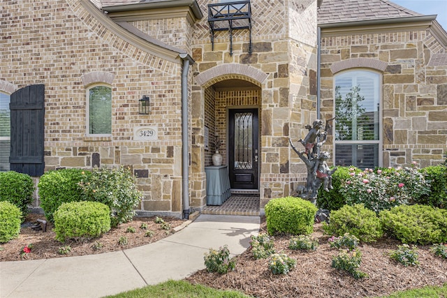 3429 Lochside, The Colony, TX 75056 - doorway to property with brick siding and stone siding