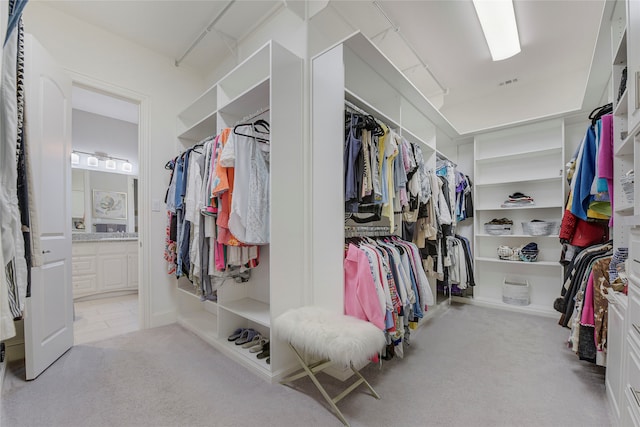 3429 Lochside, The Colony, TX 75056 - walk in closet featuring carpet and visible vents