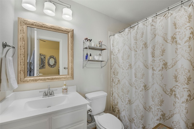 3429 Lochside, The Colony, TX 75056 - bathroom featuring a shower with shower curtain, toilet, and vanity