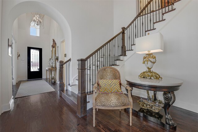 3429 Lochside, The Colony, TX 75056 - entryway featuring stairway, arched walkways, a high ceiling, and wood finished floors