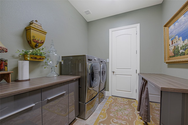 3429 Lochside, The Colony, TX 75056 - washroom with light tile patterned flooring, visible vents, independent washer and dryer, and laundry area