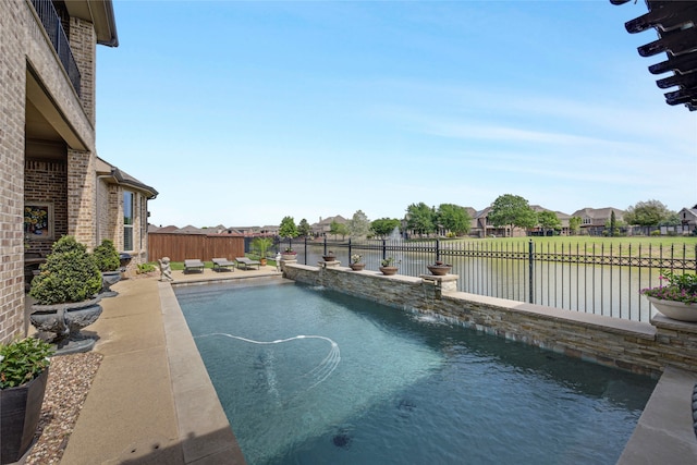 3429 Lochside, The Colony, TX 75056 - view of swimming pool with a patio area, a residential view, a fenced in pool, a water view, and a fenced backyard