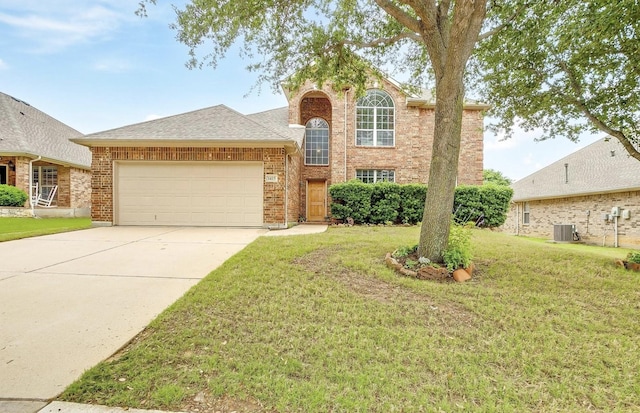 1415 Lowes Farm Pkwy, Mansfield, TX 76063 - traditional home featuring an attached garage, a front yard, concrete driveway, and brick siding