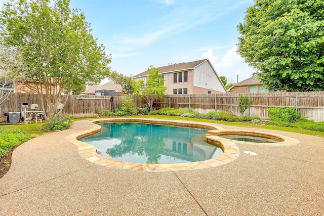 1415 Lowes Farm Pkwy, Mansfield, TX 76063 - view of pool with a fenced backyard, a pool with connected hot tub, and a patio area