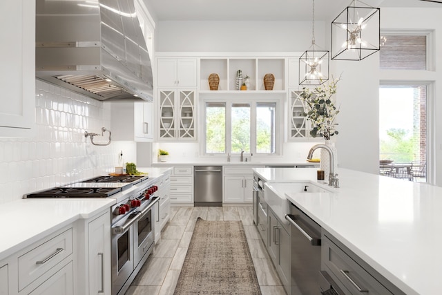 3110 High Rd, Flower Mound, TX 75022 - kitchen featuring extractor fan, stainless steel appliances, tasteful backsplash, and light countertops