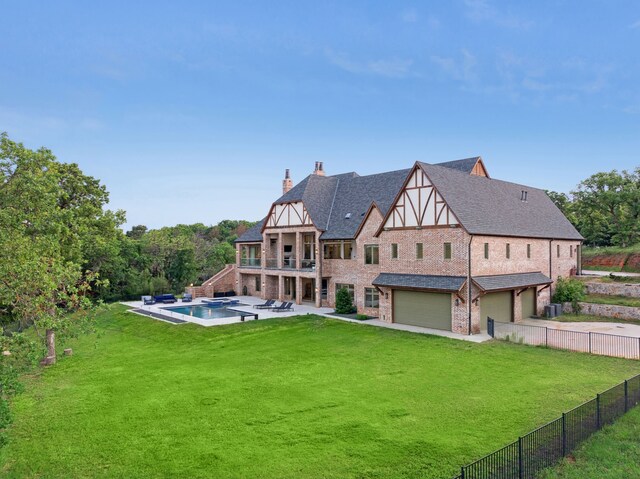 3110 High Rd, Flower Mound, TX 75022 - back of house featuring an attached garage, a chimney, a balcony, a shingled roof, and a patio area