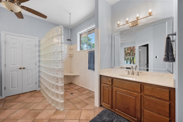 411 Pecan Point Dr, Kerens, TX 75144 - bathroom featuring vanity, tile patterned flooring, a ceiling fan, and walk in shower