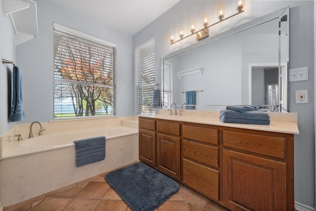 411 Pecan Point Dr, Kerens, TX 75144 - bathroom featuring vanity, tile patterned flooring, and a garden tub