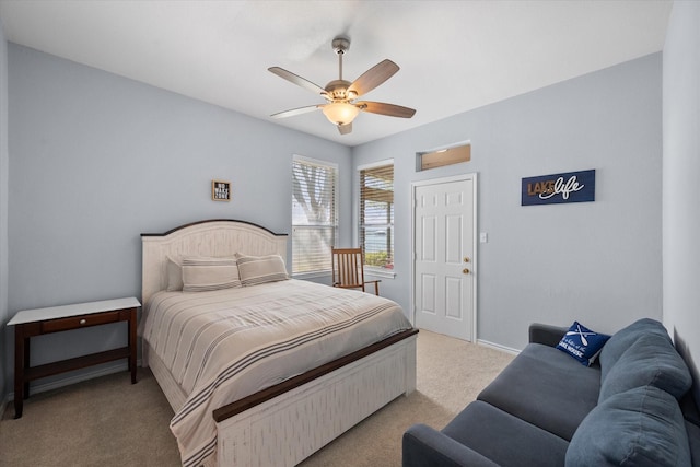 411 Pecan Point Dr, Kerens, TX 75144 - bedroom with baseboards, light carpet, and a ceiling fan