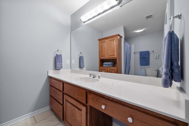 411 Pecan Point Dr, Kerens, TX 75144 - full bathroom with vanity, toilet, marble finish floor, baseboards, and visible vents