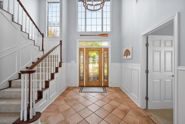 411 Pecan Point Dr, Kerens, TX 75144 - foyer with stairway, a high ceiling, a decorative wall, and a wealth of natural light