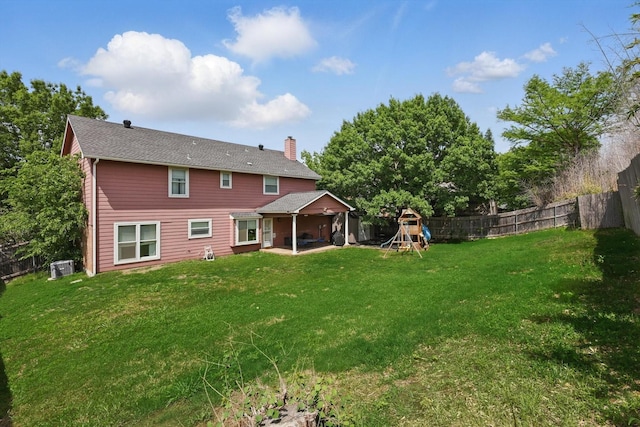 10313 Gray Oak Ln, Fort Worth, TX 76108 - back of property with a lawn, a chimney, a fenced backyard, and a patio area