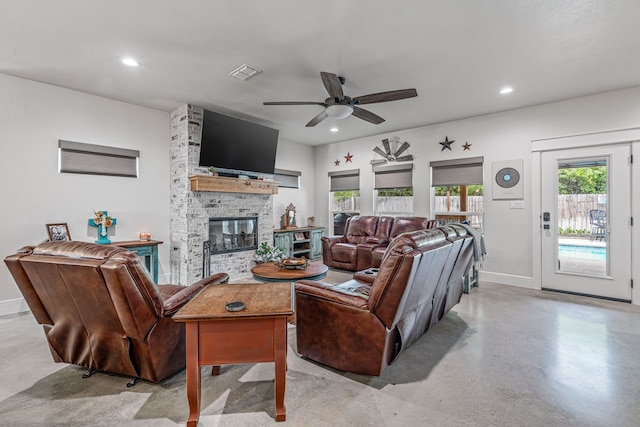 living room with recessed lighting, finished concrete flooring, baseboards, visible vents, and a ceiling fan