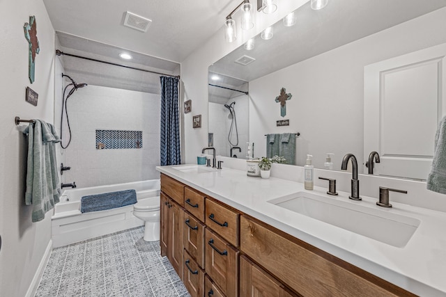 full bath with toilet, a sink, shower / bath combo with shower curtain, and visible vents