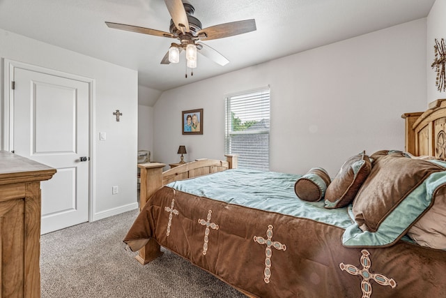 bedroom featuring lofted ceiling, ceiling fan, baseboards, and carpet floors