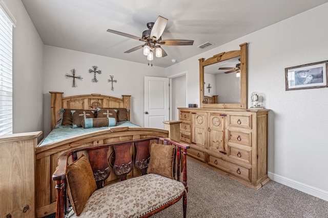 bedroom featuring baseboards, visible vents, ceiling fan, and carpet flooring