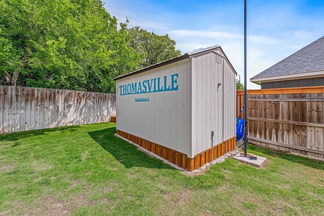 view of shed with a fenced backyard
