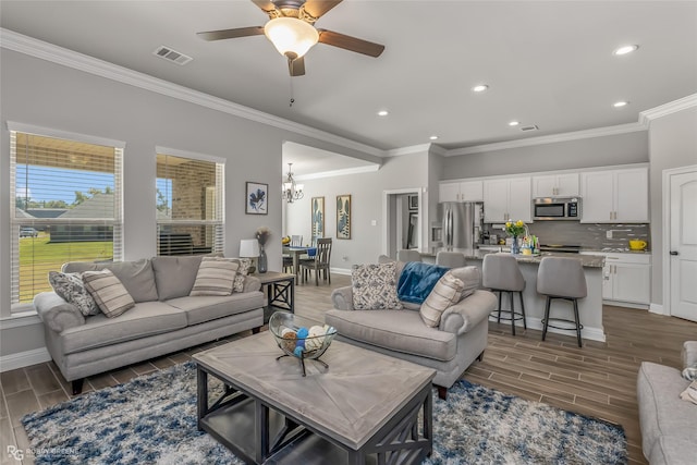 3843 Joseph Randall Dr, Shreveport, LA 71107 - living area with recessed lighting, ceiling fan with notable chandelier, visible vents, wood finish floors, and crown molding