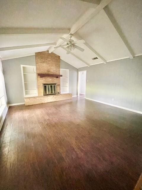unfurnished living room with baseboards, vaulted ceiling with beams, a fireplace, dark wood-style floors, and a ceiling fan