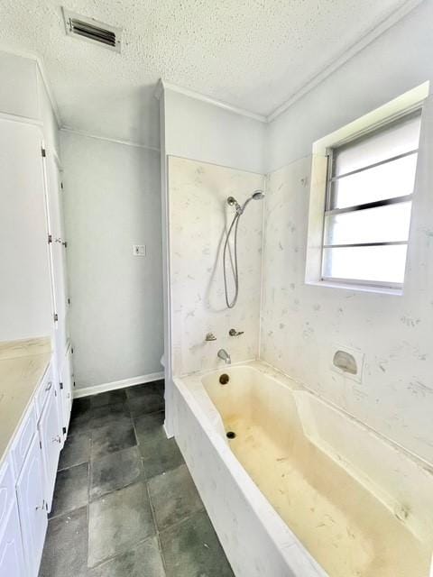 full bathroom featuring a textured ceiling, visible vents, vanity, and bathing tub / shower combination
