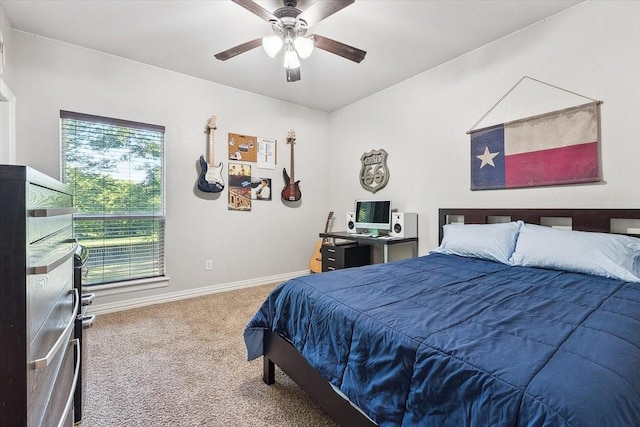 carpeted bedroom with baseboards and ceiling fan