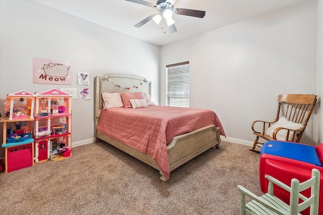carpeted bedroom featuring ceiling fan and baseboards