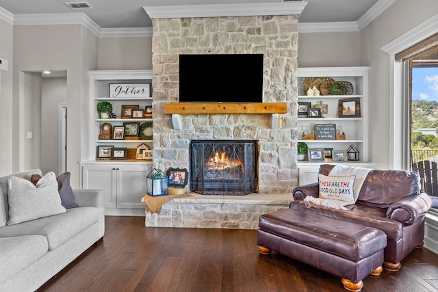 150 Cherokee Hills Ln, Abilene, TX 79606 - living room featuring visible vents, hardwood / wood-style flooring, crown molding, and a fireplace