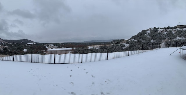150 Cherokee Hills Ln, Abilene, TX 79606 - snowy yard featuring fence and a mountain view
