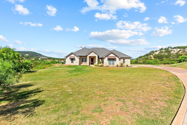 150 Cherokee Hills Ln, Abilene, TX 79606 - french provincial home with a front lawn and stone siding