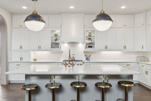 14000 Walsh Ave, Fort Worth, TX 76008 - kitchen with a kitchen breakfast bar, arched walkways, white cabinetry, light countertops, and recessed lighting