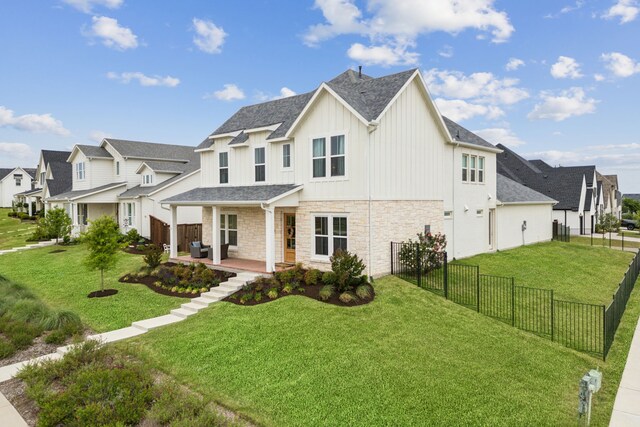 14000 Walsh Ave, Fort Worth, TX 76008 - view of front of home featuring board and batten siding, stone siding, a residential view, and a patio