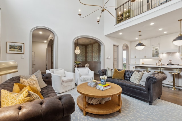 14000 Walsh Ave, Fort Worth, TX 76008 - living room with arched walkways, wood finished floors, and a high ceiling