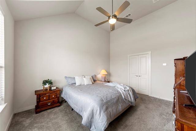 carpeted bedroom featuring baseboards, visible vents, a ceiling fan, and a closet