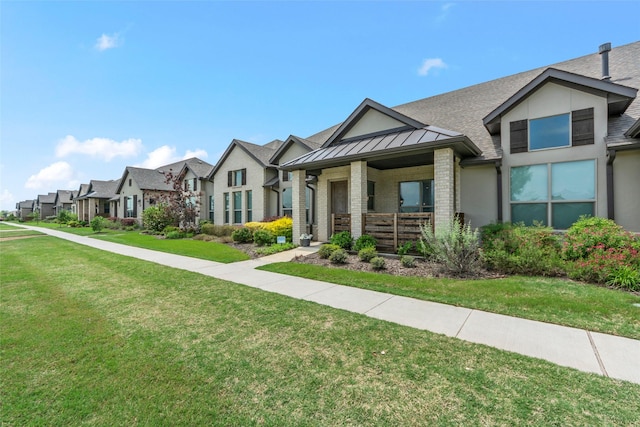 craftsman-style home featuring a front lawn, a standing seam roof, a residential view, metal roof, and covered porch