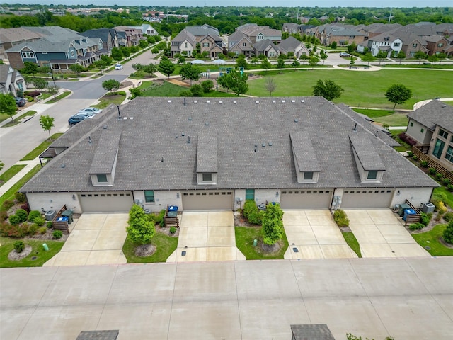birds eye view of property with a residential view