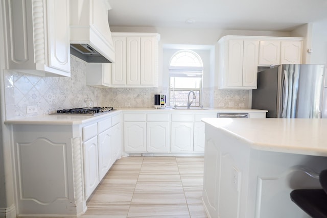 222 Crestview Dr, Midlothian, TX 76065 - kitchen with light countertops, stainless steel appliances, custom exhaust hood, and a sink