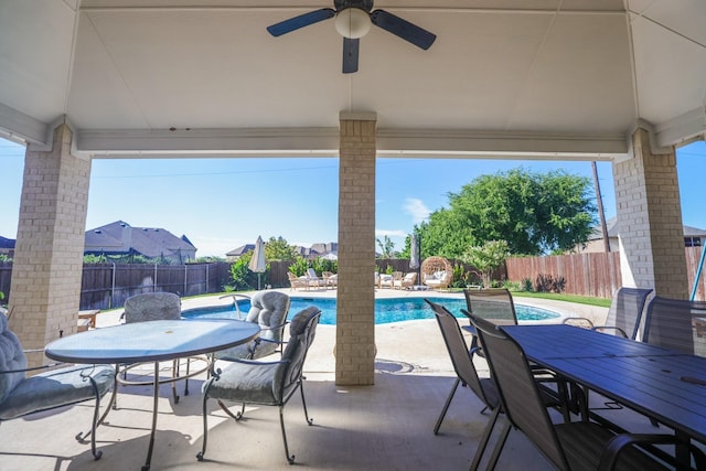 222 Crestview Dr, Midlothian, TX 76065 - view of patio / terrace with a fenced backyard, a fenced in pool, outdoor dining space, and a ceiling fan