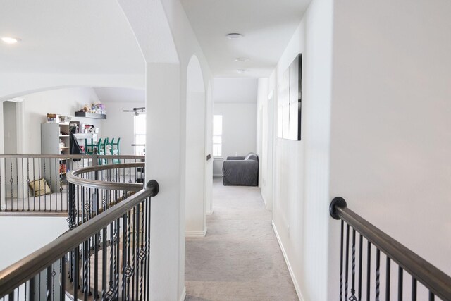 222 Crestview Dr, Midlothian, TX 76065 - corridor featuring baseboards, carpet flooring, arched walkways, and an upstairs landing