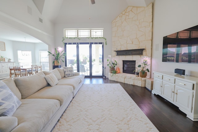 222 Crestview Dr, Midlothian, TX 76065 - living room featuring ceiling fan, high vaulted ceiling, a stone fireplace, dark wood-type flooring, and visible vents