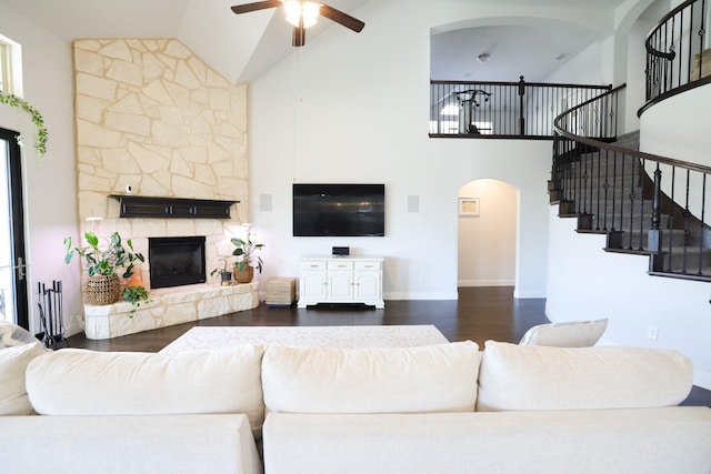 222 Crestview Dr, Midlothian, TX 76065 - living area with arched walkways, stairs, ceiling fan, and high vaulted ceiling