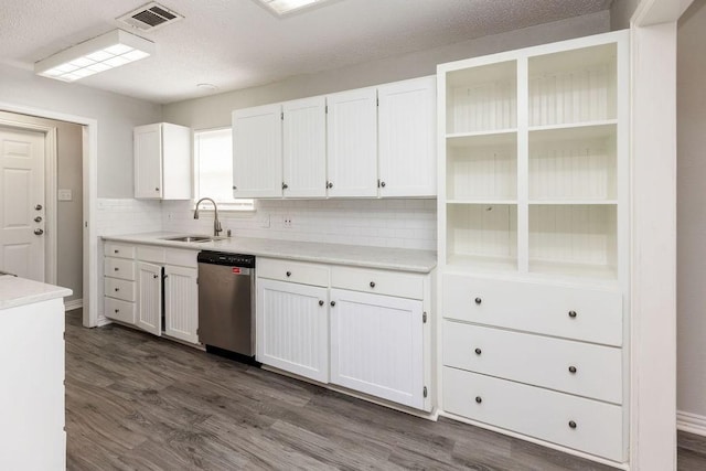kitchen with a sink, visible vents, white cabinetry, dishwasher, and dark wood finished floors